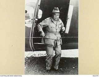 DUMPU, RAMU VALLEY AREA, NEW GUINEA. 1943-12-19. VX1 GENERAL SIR THOMAS BLAMEY, GBE., KCB., CMG., DSO., ED., COMMANDER-IN-CHIEF, ALLIED LAND FORCES SOUTH WEST PACIFIC AREA, DISEMBARKING FROM HIS ..