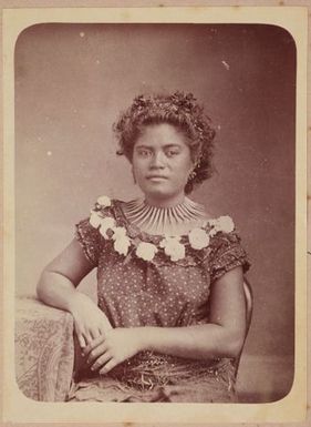 Young woman sitting at table with short hair. From the album: Tahiti, Samoa and New Zealand scenes