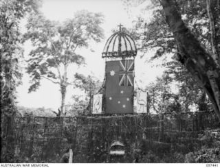 RAMALE VALLEY, NEW BRITAIN. 1945-10-02. THE STAGE SETTING FOR THE CHORAL FESTIVAL STAGED AS A THANKSGIVING FOR LIBERATION AT RAMALE MISSION. PERSONNEL OF 11 DIVISION AMONG THOSE WHO ATTENDED