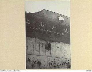 1943-05-19. NEW GUINEA. GONA. THIS WRECKED JAPANESE SHIP "AYATOSAN MARU", SUNK BY ALLIED AIRCRAFT DURING THE BATTLE OF GONA. IT IS NOW USED FOR TARGET PRACTICE BY ALLIED FORCES AT GONA BEACH. ..