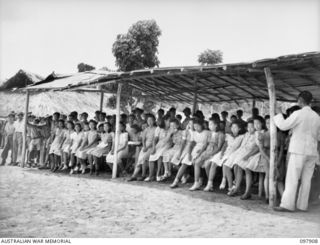 RABAUL, NEW BRITAIN. 1945-10-10. A SPECIAL PARADE AND CONCERT WAS HELD AT THE CAMP TO CELEBRATE THE 34TH ANNIVERSARY OF THE FOUNDING OF THE CHINESE REPUBLIC. MAJOR GENERAL K.W. EATHER, GENERAL ..