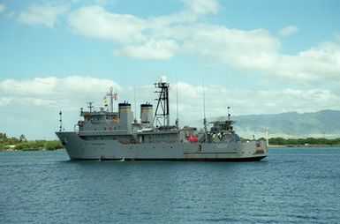 A port view of the Military Sealift Command ocean surveillance ship USNS TRIUMPH (T-AGOS-4) underway in the channel as it departs from the naval station.