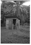 Man outside small shed