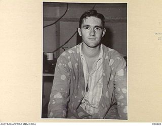 LAE AREA, NEW GUINEA. 1945-08-11. LIEUTENANT G.M. DOWNING WEARING AN ARTIFICIAL EYE WHICH WAS FITTED AT 2/7 GENERAL HOSPITAL