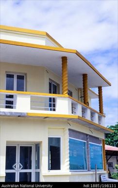 New Caledonia - orange and cream building with corkscrew columns