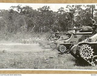 SOUTHPORT, QLD. 1944-01-18. MATILDA AND GENERAL GRANT TANKS OF THE 4TH ARMOURED BRIGADE FIRING SMALL CALIBRE WEAPONS DURING A DEMONSTRATION STAGED FOR A CONTINGENT OF NEW GUINEA POLICE BOYS WHO ARE ..