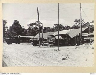 BOUGAINVILLE. 1945-08-30. A GENERAL VIEW OF 113 BRIGADE WORKSHOP CORPS OF AUSTRALIAN ELECTRICAL AND MECHANICAL ENGINEERS ON THE BUIN ROAD SOUTH OF THE PURIATA RIVER