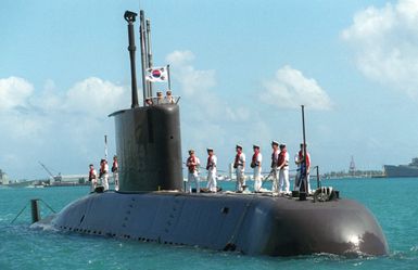 Sailors onboard the Korean submarine LEE CHUN stand at the ready, as they prepare to go pier-side in Apra Harbor, Guam. The Koreans are joining by other allied forces in Guam to participate in Exercise TANDEM THRUST '99