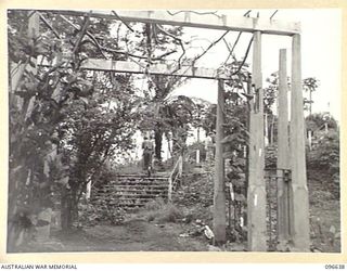 RABAUL, NEW BRITAIN. 1945-09-14. ENTRANCE PORTAL AND STEPS TO THE SITE OF THE FORMER GOVERNMENT HOUSE AT RABAUL. FOLLOWING THE SURRENDER OF THE JAPANESE HEADQUARTERS 11 DIVISION HAS ESTABLISHED ITS ..