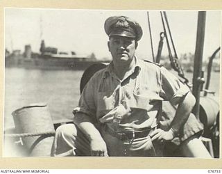 AITAPE, NEW GUINEA. 1944-10-26. LIEUTENANT W.V. WOODS, ROYAL AUSTRALIAN NAVAL VOLUNTEER RESERVE, SEA TRANSPORT OFFICER, AITAPE, ABOARD THE RAN CORVETTE GYMPIE