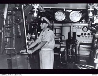 RABAUL, NEW BRITAIN, 1946-03-07. LIEUTENANT COMMANDER W. FARR, RAN, ENGINEER OFFICER, IN THE ENGINE ROOM ABOARD HMAS BARCOO, (K375) ROYAL AUSTRALIAN NAVY