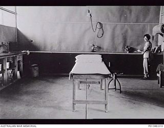 AITAPE, NEW GUINEA. C. 1945-03. PHYSIOTHERAPIST LIEUTENANT J. DICKSON, AUSTRALIAN ARMY NURSING SERVICE, IN THE PLASTER ROOM, 2/11TH AUSTRALIAN GENERAL HOSPITAL. (DONOR E. FUSSELL)