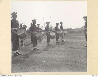 CAPE WOM, NEW GUINEA, 1945-09-13. DRUMMERS OF 19 INFANTRY BRIGADE MILITARY BAND. PICTURE TAKEN PRIOR TO THE SURRENDER CEREMONY HELD AT CAPE WOM AIRSTRIP WHERE LIEUTENANT-GENERAL H. ADACHI, ..