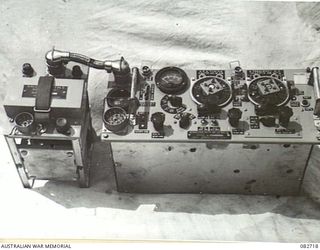 MADANG, NEW GUINEA. 1944-10-12. A NO. 19M2 SET AND POWER UNIT OF AMERICAN MANUFACTURE FROM A SHERMAN TANK. THE TANKS ARE ENGAGED IN TESTS AT HQ 4 ARMOURED BRIGADE