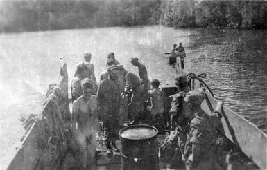 Men on wooden swimming platform