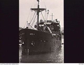 MOROBE, NEW GUINEA. 1943-09-18. SS. "SUNG SONG" TIED UP AT THE JETTY. THIS SHIP, UNDER AMERICAN CHARTER, HAS BEEN CARRYING SUPPLIES ALONG THE NEW GUINEA COAST. PRIOR TO THE WAR THIS VESSEL WAS ON ..