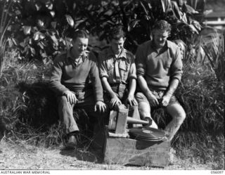 EDIE CREEK, NEW GUINEA. 1943-08-15. NX137958 CORPORAL A. GIETZELT (LEFT), N151408 SAPPER S. J. EDEN (CENTRE) AND SAPPER C. H. J. TOWNSHEND (RIGHT), ALL OF HEADQUARTERS, ROYAL AUSTRALIAN ENGINEERS, ..