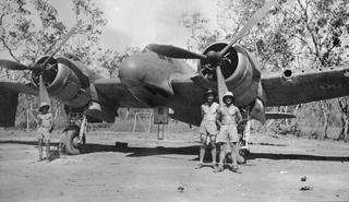 40196 Sergeant (Sgt) James Rupert Wilson (middle) and 416205 Sgt Thomas Ian Butterfield (right) of No. 30 Squadron RAAF beside their Beaufighter aircraft. Sgts Wilson and Butterfield were lost on ..