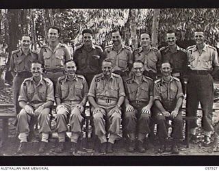 DOBODURA, NEW GUINEA. 1943-10-11. GROUP PORTRAIT OF OFFICERS OF THE ORIGINAL MILNE BAY FORCE WHO TOOK PART IN THE MILNE BAY CAMPAIGN UNDER MAJOR GENERAL C. A. CLOWES CBE DSO MC. LEFT TO RIGHT:- ..