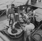 Willard N. Bascom (left) and others ready an instrument raft aboard R/V Spencer F. Baird, Bikini Atoll area