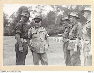 BOUGAINVILLE. 1945-06-08. GENERAL SIR THOMAS A. BLAMEY, COMMANDER-IN-CHIEF, ALLIED LAND FORCES, SOUTH WEST PACIFIC AREA (2) AND SENIOR OFFICERS FOLLOWING THE INSPECTION OF 7 INFANTRY BRIGADE AT ..