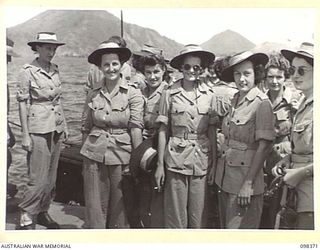 RABAUL, NEW BRITAIN. 1945-10-26. A GROUP OF AUSTRALIAN ARMY MEDICAL WOMEN'S SERVICE ON THE WHARF AT RABAUL. THEY HAVE JUST ARRIVED AND WILL STAFF 118 AUSTRALIAN GENERAL HOSPITAL