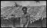 Man standing by house