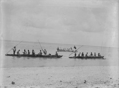 [Pacific Island men and Servicemen in canoes and a rowboat]