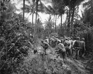 ADMIRALTY ISLANDS. 1944-03-18. AMERICAN TROOPS SEEKING OUT JAPANESE STRAGGLERS ON LOS NEGROS ISLAND