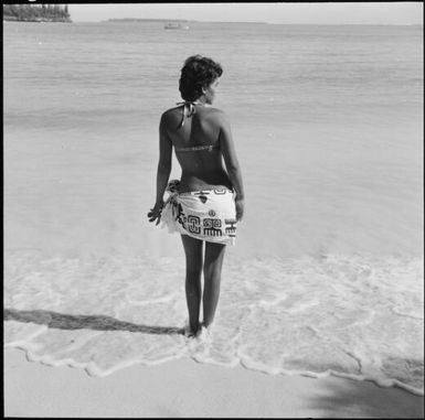 A woman on a beach in a swimsuit, New Caledonia, 1967 / Michael Terry