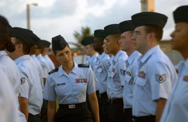 U.S. Air Force 36th Communication Squadron (CS), 36th Air Expeditionary Wing MASTER SGT. Ruby L. Gravely, Non-commissioned Officer in Charge, Network Control Center, inspects 36th CS Airmen at Andersen Air Force Base, Guam, on Jan. 19, 2005. (U.S. Air Force PHOTO by TECH. SGT. Cecilio M. Ricardo Jr.) (Released)