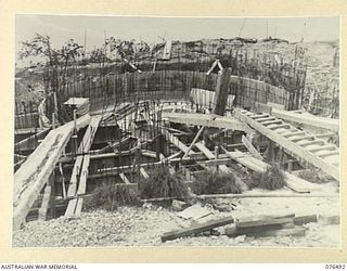 PORT MORESBY, PAPUA. 1944-10-18. WOODEN FORMERS AND STEEL REINFORCING IN POSITION AND READY FOR POURING ON NO.3 GUN EMPLACEMENT OF THE BASILISK BATTERY, 801ST ANTI-AIRCRAFT AND COAST ARTILLERY ..