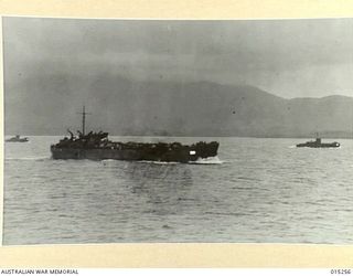 1943-07-12. AMERICAN ADVANCE INTO TROBRIAND ISLANDS. THIS PICTURE IS ONE OF THE FIRST OF THE AMERICAN ADVANCE AND SHOWS THREE SHIPS OF THE CONVOY SAILING NORTHWARD UNDER SULLEN SKIES. (NEGATIVE BY ..