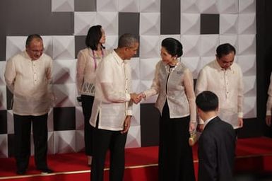 Barack Obama joins Asia Pacific Economic Cooperation Summit leaders and spouses for a group photo in Pasay, Metro Manila, Philippines, November 18, 2015