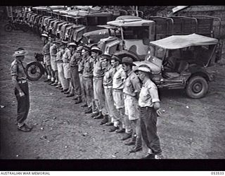 SOGERI VALLEY, NEW GUINEA. 1943-06-27. VEHICLES AND MOTOR TRANSPORT STAFF OF THE NEW GUINEA FORCE SCHOOL OF SIGNALS. VX14688 STAFF SERGEANT G. PHILLIPS IS IN CHARGE OF THE SQUAD. LEFT TO RIGHT: ..