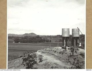 12 MILE, LALOKI RIVER, NEW GUINEA. 1943-11-15. VIEW OF THE NO. 3 GARDEN OF THE 3RD AUSTRALIAN FARM COMPANY, AUSTRALIAN ARMY SERVICE CORPS TAKEN FROM THE ADMINISTRATIVE BUILDING