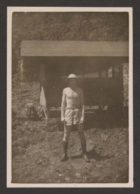 [Man Standing in Front of Mess Hall]