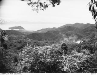 SALAMAUA, NEW GUINEA, 1943-08-09. ARTILLERY SMOKE SHELLS FIRED DURING RANGING ON ORODUBI. PHOTOGRAPH TAKEN FROM WELLS OBSERVATION POST