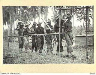 MILILAT, NEW GUINEA. 1944-07-22. A SURVEY TEAM FROM THE 5TH SURVEY BATTERY, SETTING OUT FROM THEIR CAMP TO WORK ON THE MILIAT SECTION OF THE MADANG-ALEXISHAFEN ROAD. IDENTIFIED PERSONNEL ARE:- ..