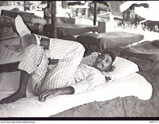 BORAM BEACH, NEW GUINEA, 1945-10-14. ELEVEN INDIAN SOLDIERS WERE LIBERATED FROM THE JAPANESE AT MARIENBERG IN THE SEPIK RIVER AREA, AND TAKEN TO 2/15TH FIELD AMBULANCE FOR MEDICAL TREATMENT. SHOWN, ..