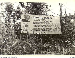 FINSCHHAFEN AREA, NEW GUINEA, 1944-03-17. ONE OF MANY BATTLE SIGNS IN THE FINSCHHAFEN AREA, THIS SIGN RECORDS ACTIVITIES OF THE 2/48TH INFANTRY BATTALION