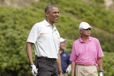 Barack Obama plays golf with Prime Minister Najib Razak, Joe Paulsen, and Mike Brush in Kaneohe Bay, Hawaii, December 24, 2014