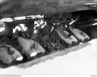 Cape Boram, Wewak area, New Guinea.  The left hand side view of the engine in an armoured recovery variant of the medium type 97 Chi Ha tank, which was captured on the beach.  Army workshops, the ..