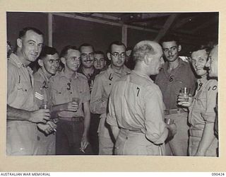 TOROKINA, BOUGAINVILLE. 1945-04-09. PERSONNEL WITH SENATOR FRASER, ACTING MINISTER FOR THE ARMY (7), AT THE SGTS MESS, HQ 2 CORPS. IDENTIFIED PERSONNEL ARE:- SGT A. PITTS (1); SGT G. SANDERSON (2); ..