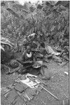 Pig festival, pig sacrifice, Tsembaga: ritual exchange of shell valuables, steel axes, and other wealth displayed on mat, pork is shared