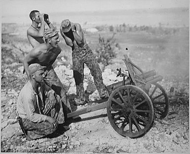 After the Marines captured this mountain gun from the Japanese at Saipan, they put it into use during the attack on Garapan, administrative center of the island.