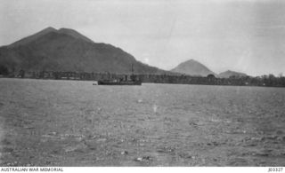 THE THREE EXTINCT VOLCANOES AT RABAUL, WITH THE "YARRA" AT ANCHOR. (DONATED BY LT.-COM. G.A. HILL, RNR.)