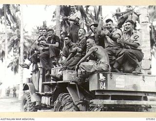 LAE, NEW GUINEA. 1944-08-19. BARRACKERS FROM HEADQUARTERS, 5TH DIVISION MAKE GOOD USE OF ONE OF THE UNIT WATER TANKS DURING THE INTER-UNIT SPORTS MEETING WITH THE HMAS "MANOORA". IDENTIFIED ..
