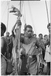 Larikeni, father of the bride, with valuables he has collected at marriage feast for his daughter