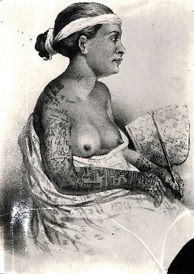 Photo of a bare-breasted woman revealing her tattoos (XXI/1)